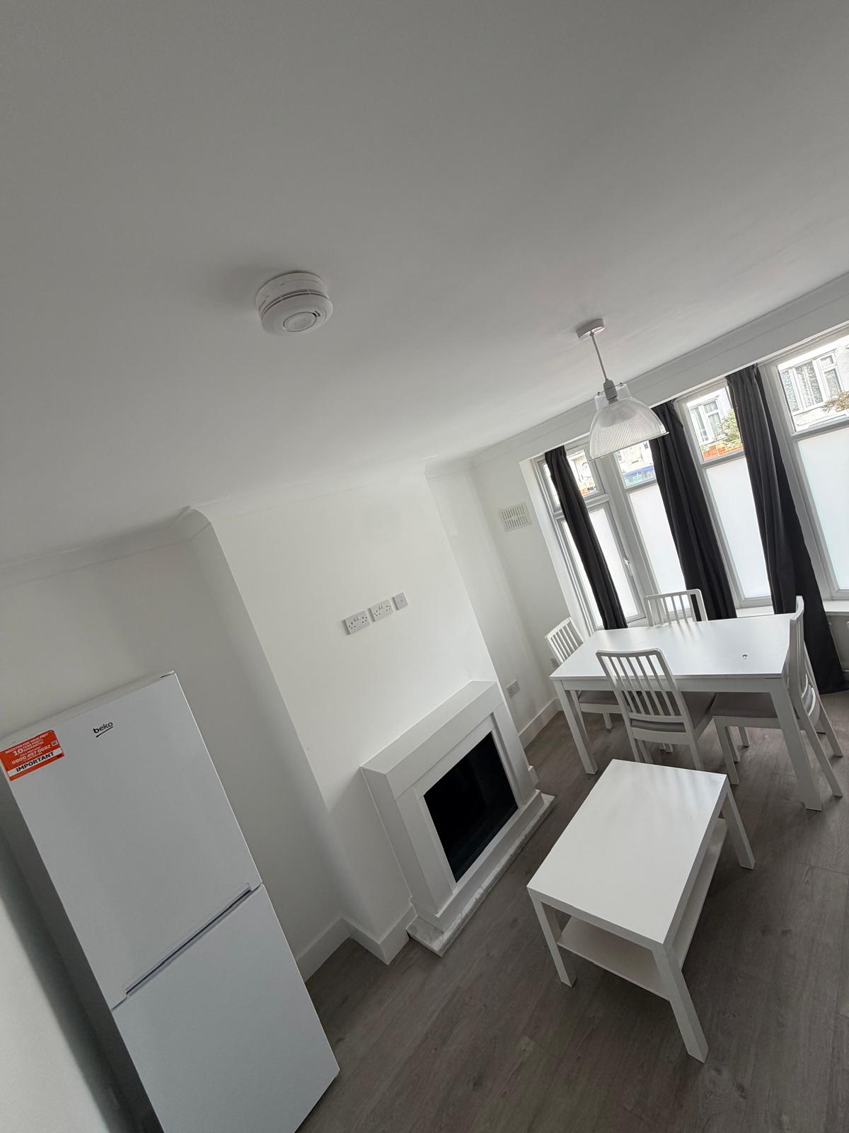 Bright and spacious living room and dining area at a Kope-Medics supported living home