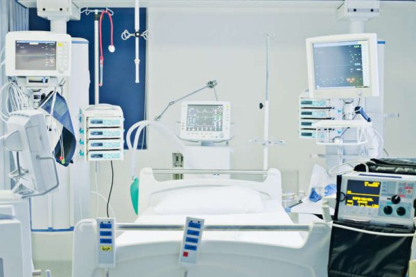 Empty hospital bed in intensive care